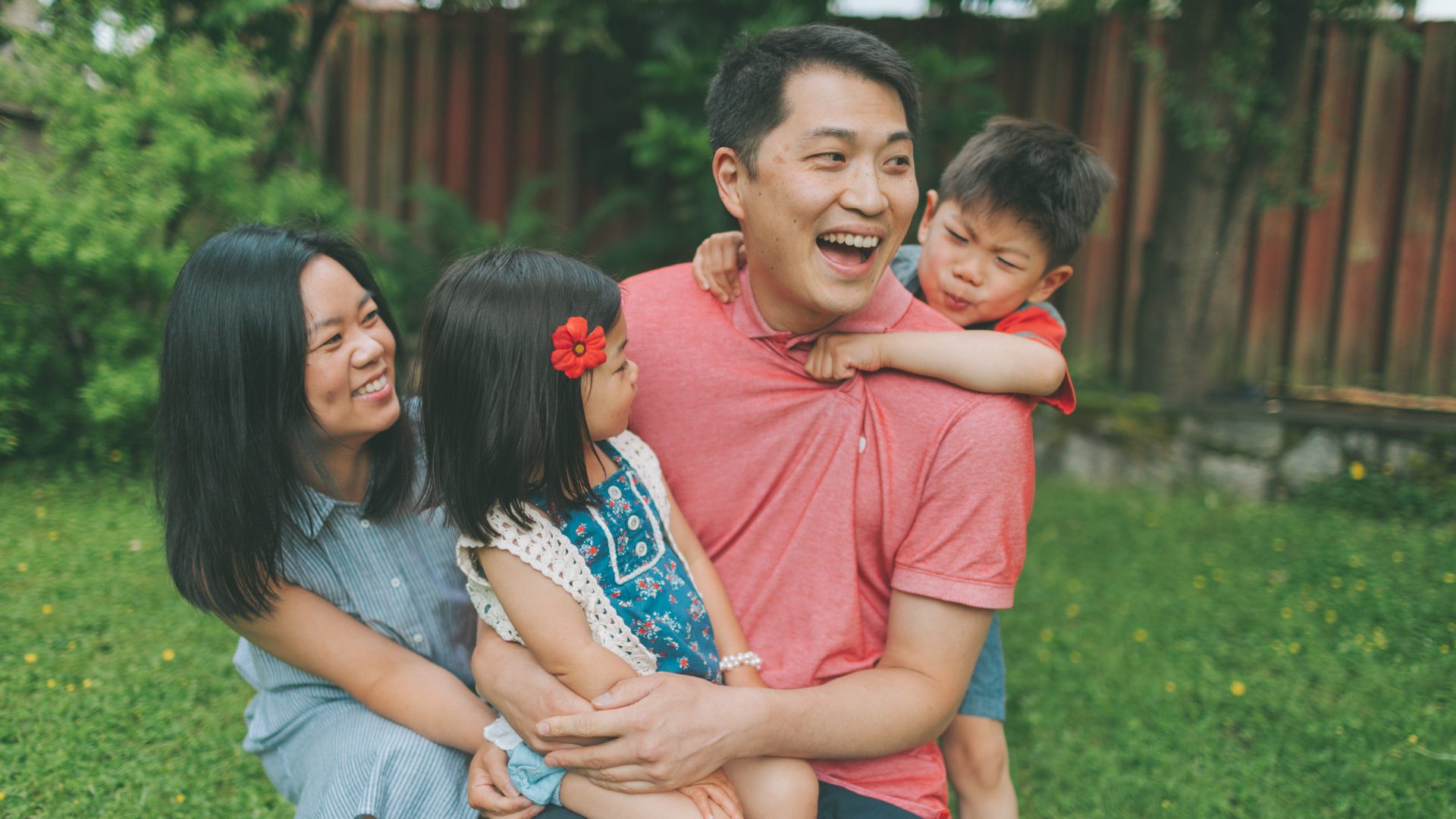 Family laughing together outdoors