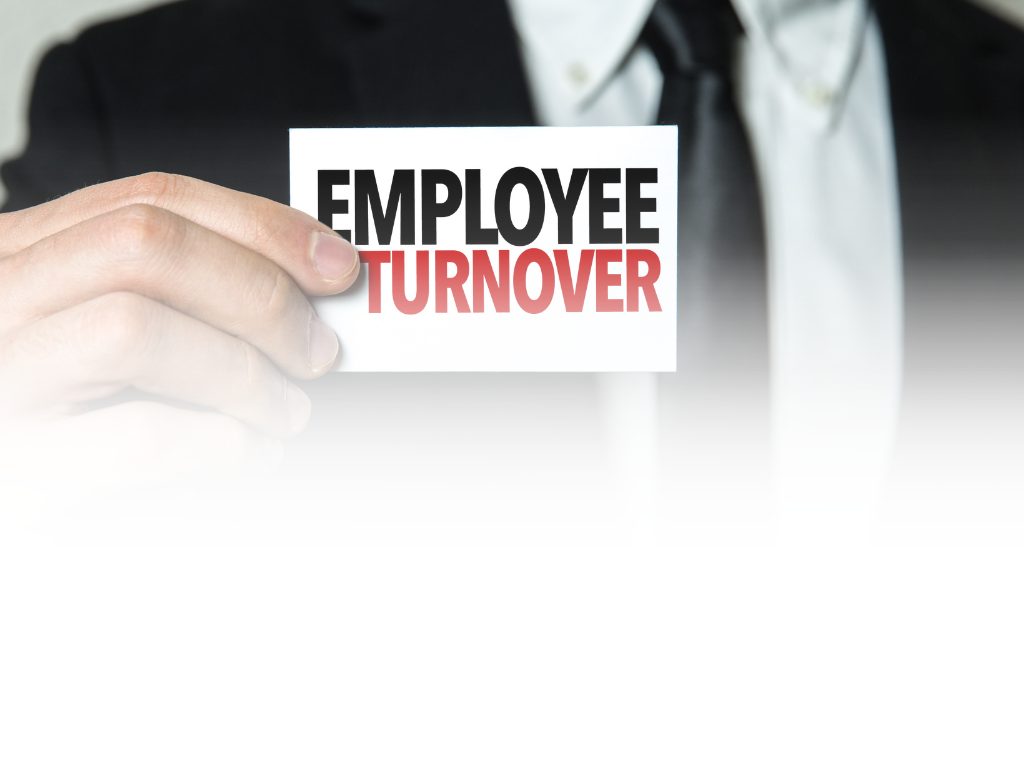 Businessman holding an Employee Turnover card