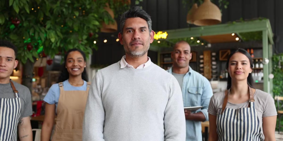 Group of EB-3 hospitality workers smiling together