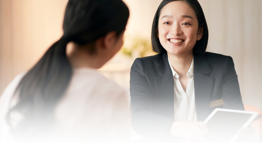 Candidate smiling during a screening and consultation call