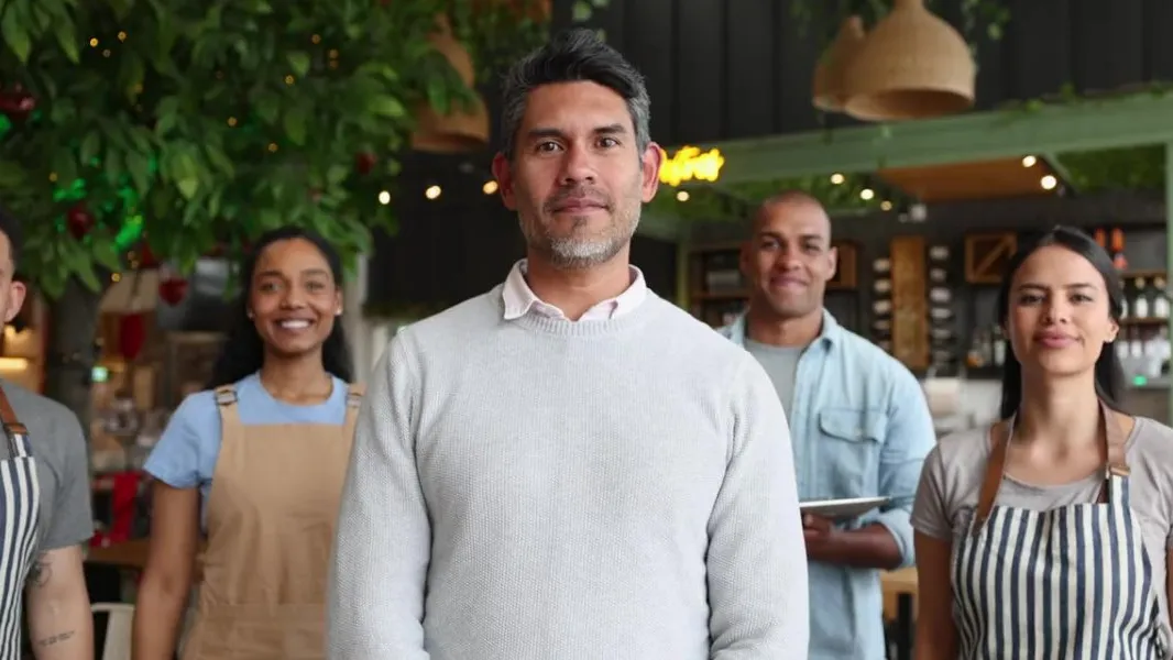 An employer with their team