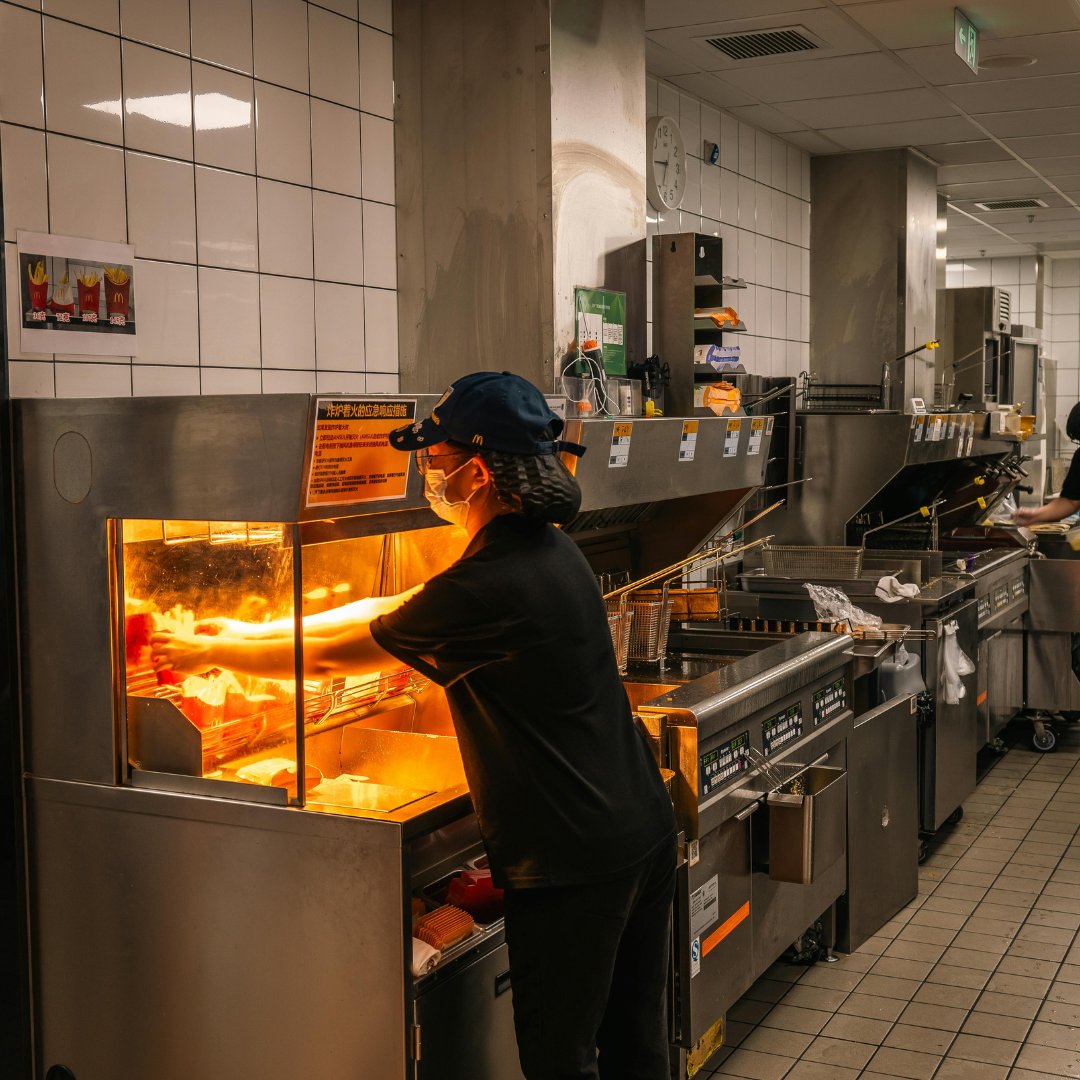 Kitchen worker at a fryer station