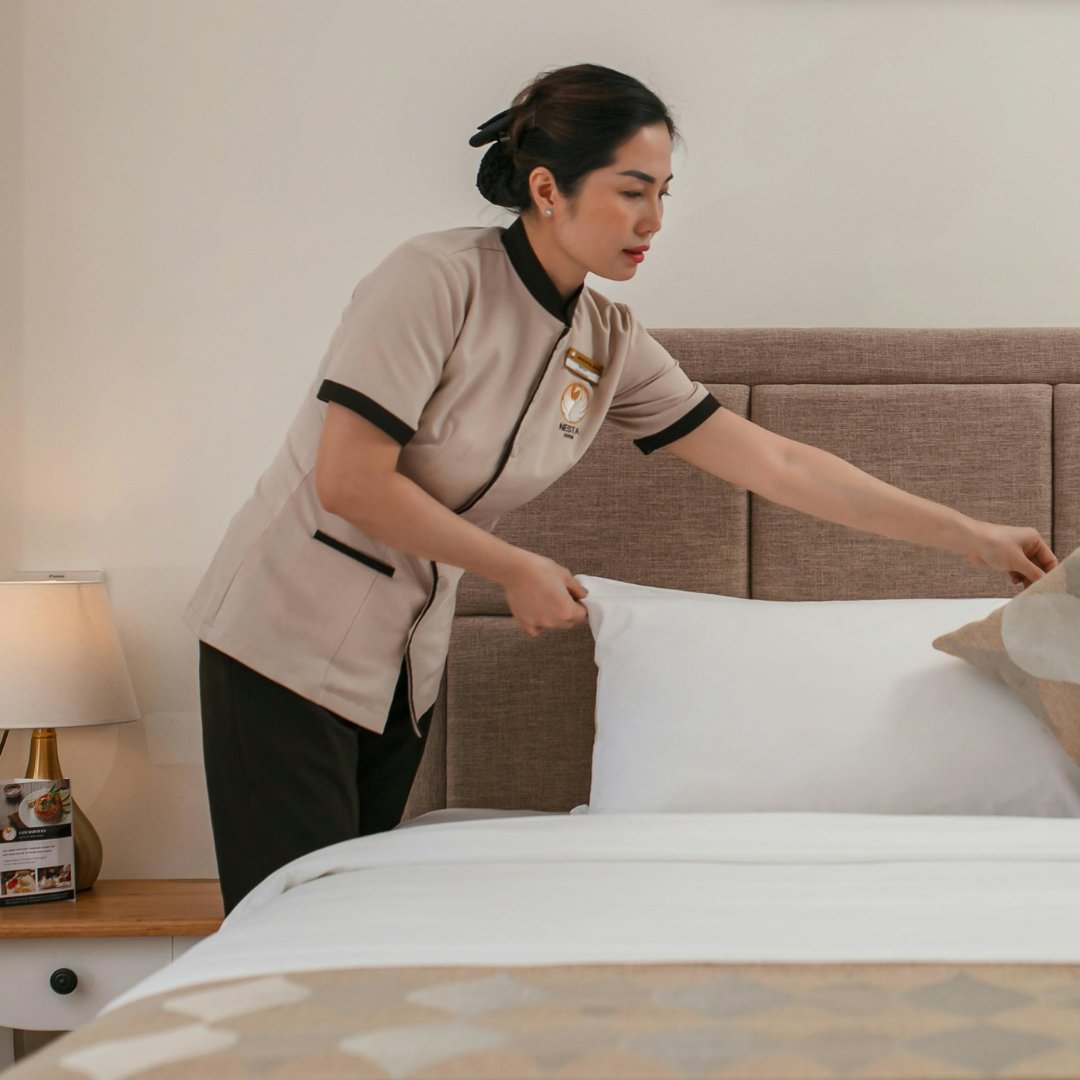 Room attendant preparing a hotel room